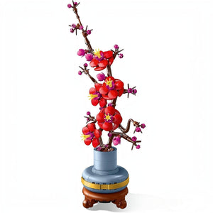 A Brick Apart LEGO Icons Plum Blossom set featuring a woody stem with vivid red and magenta flowers in a blue pot.
