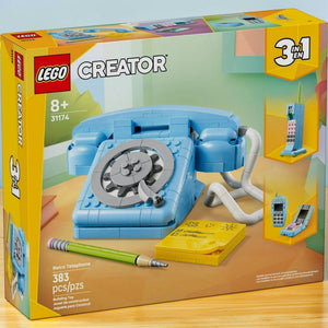[lifestyle-shelf-box] A Brick Apart LEGO Creator 3in1 Retro Telephone building set box showing a blue 1960s style rotary phone model.