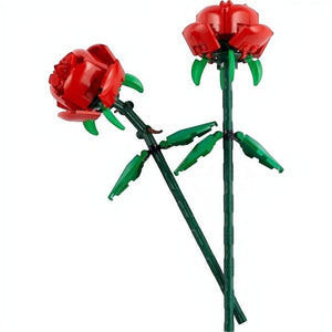 A Brick Apart LEGO Botanicals Roses set featuring two red brick-built flowers with adjustable green stems and leaves.