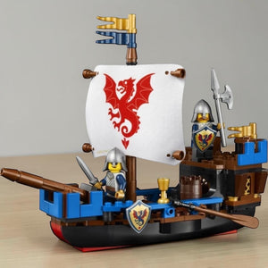 A Brick Apart LEGO Ideas Sea Serpent ship model with fabric sail, two knight minifigures, and medieval details.