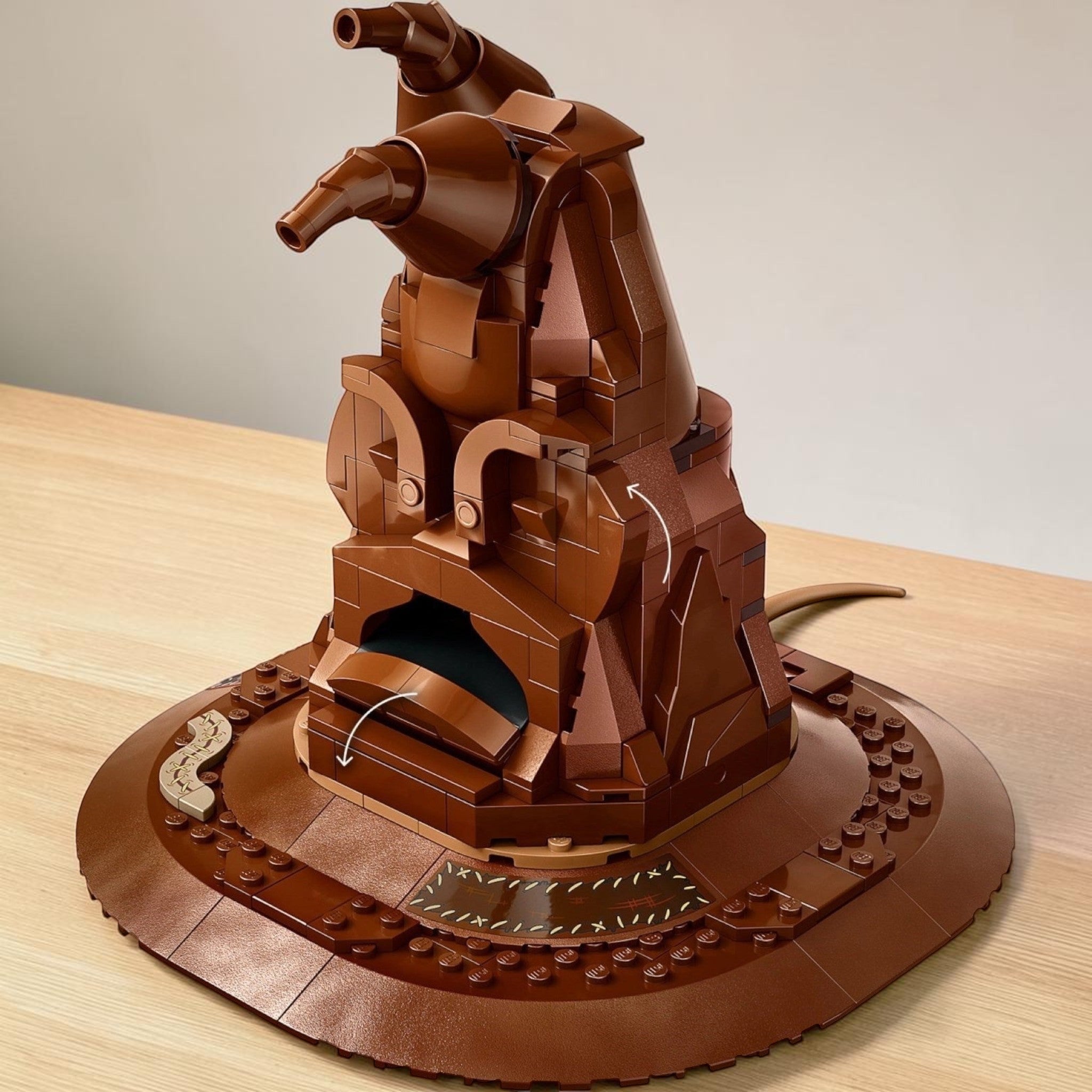A Brick Apart LEGO Harry Potter Talking Sorting Hat buildable model with brown bricks and interactive sound features.