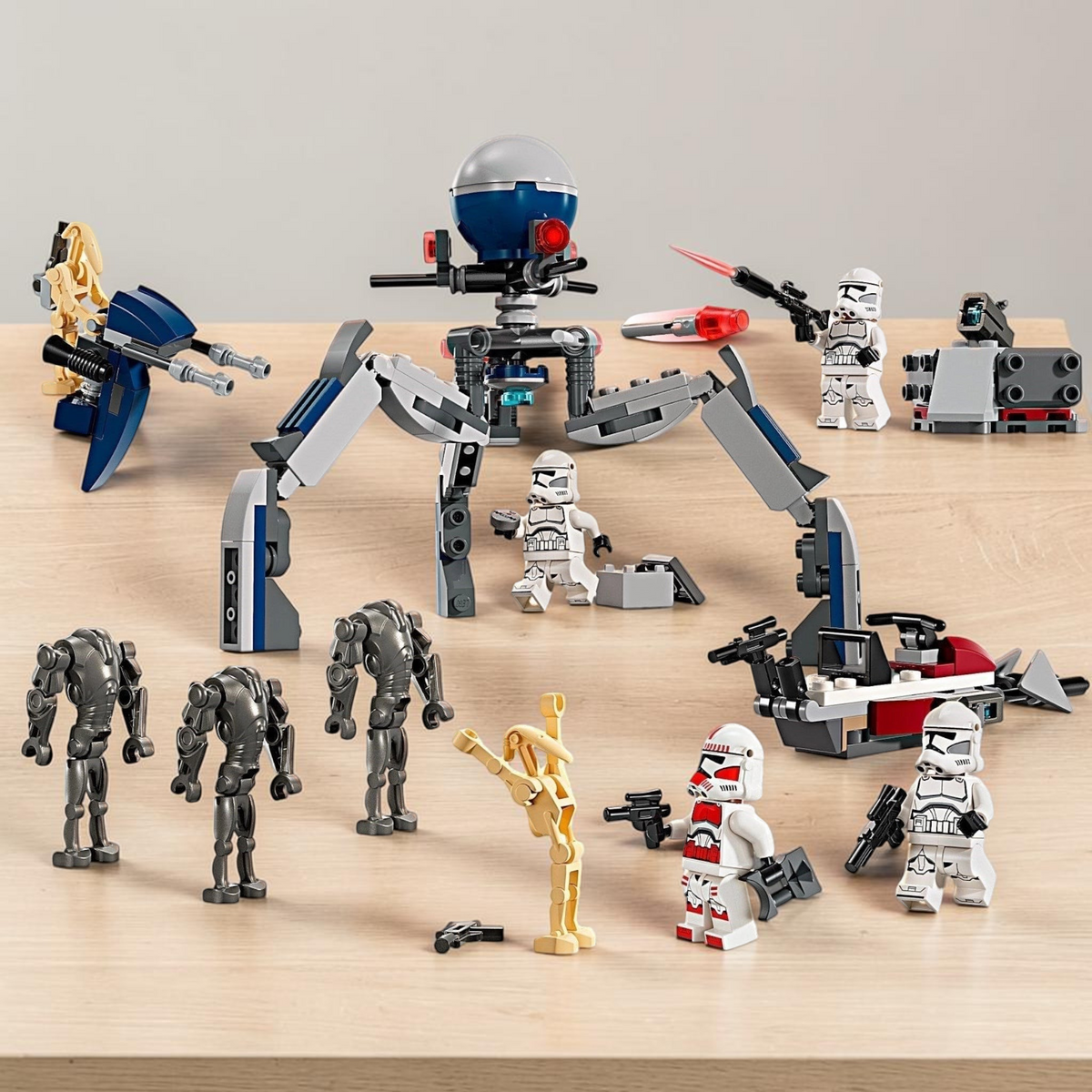 [lifestyle-shelf-built] A Brick Apart LEGO Star Wars Clone Trooper and Battle Droid battle pack featuring minifigures, speeders, and a tri-droid