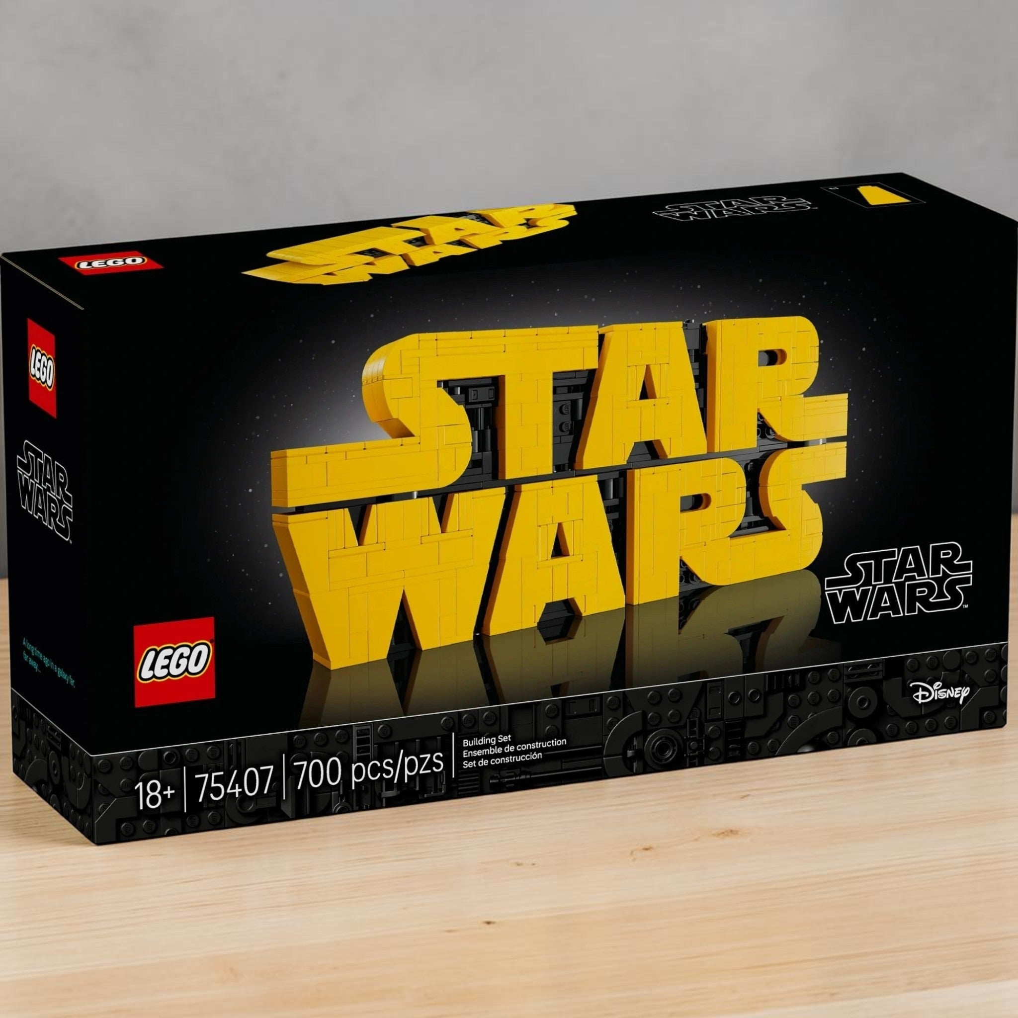 A Brick Apart LEGO Star Wars 75407 brick-built logo model kit box featuring yellow 3D lettering on a black background.