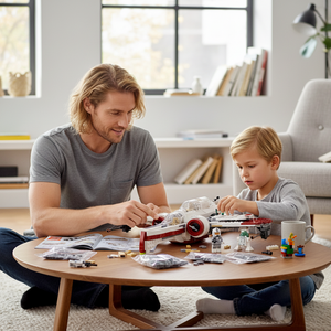 [lifestyle-person] A Brick Apart father and son building the LEGO Star Wars ARC-170 Starfighter set together on a wooden coffee table.