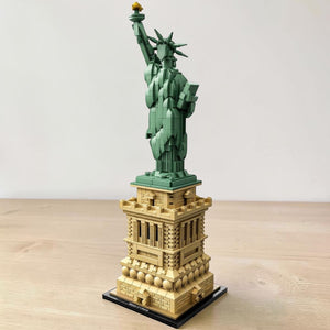 A Brick Apart LEGO Architecture Statue of Liberty model showing the green statue on a detailed tan pedestal.