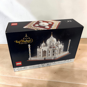 [lifestyle-shelf-box] A Brick Apart LEGO Architecture Taj Mahal set box featuring a detailed white model of the iconic monument.