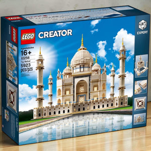 [lifestyle-shelf-box] A Brick Apart LEGO Creator Expert Taj Mahal set box featuring the ivory-white marble mausoleum model and 5923 pieces.