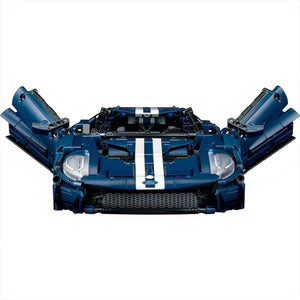 [built-detail] A Brick Apart LEGO Technic 2022 Ford GT model in dark blue with white racing stripes and open butterfly doors