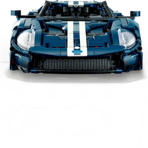 A Brick Apart LEGO Technic 2022 Ford GT model in dark blue with white racing stripes, viewed from the front.