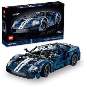 A Brick Apart LEGO Technic 2022 Ford GT model in dark blue with white racing stripes, featuring realistic car details.