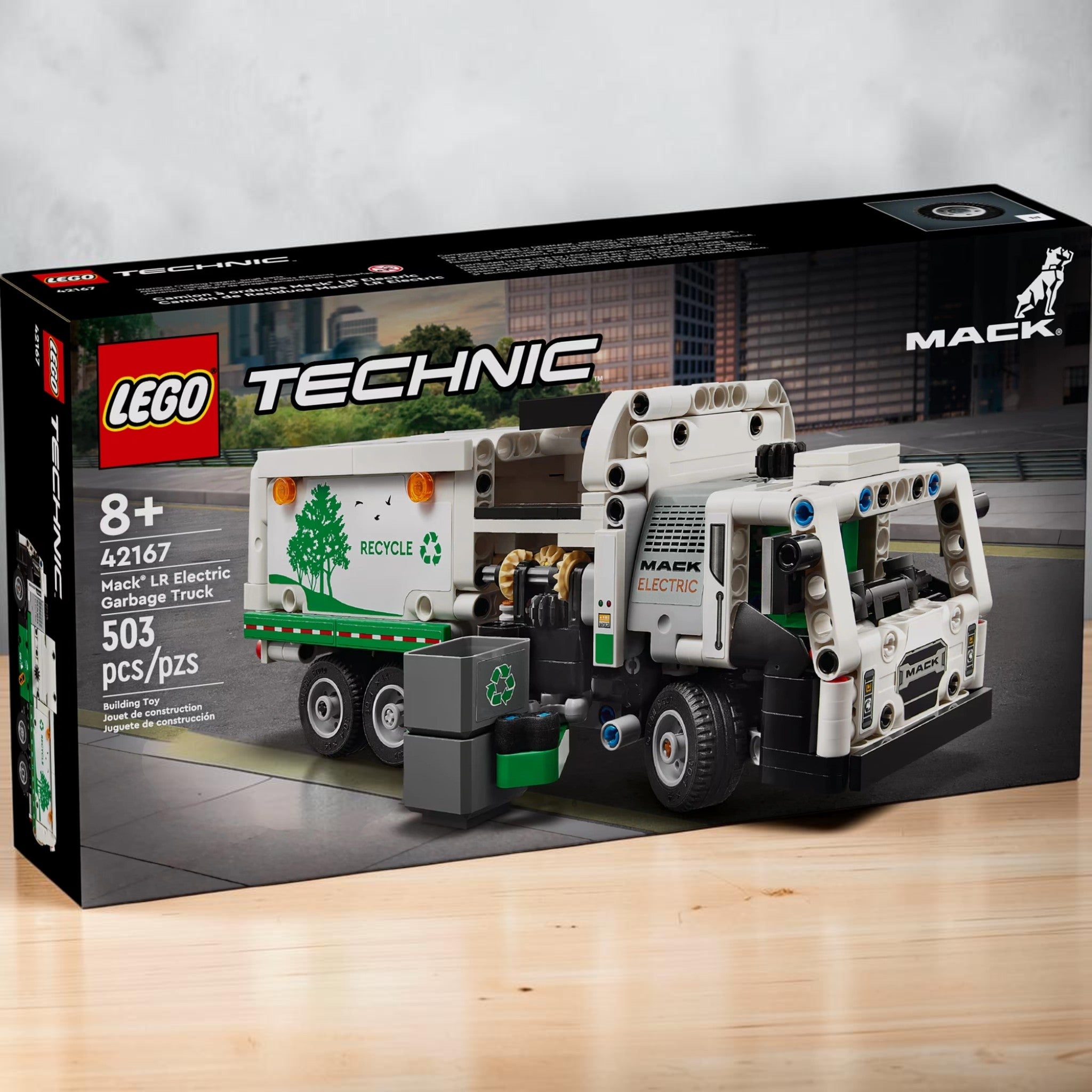 A Brick Apart LEGO Technic Mack LR Electric Garbage Truck building set box featuring a white and green toy truck.