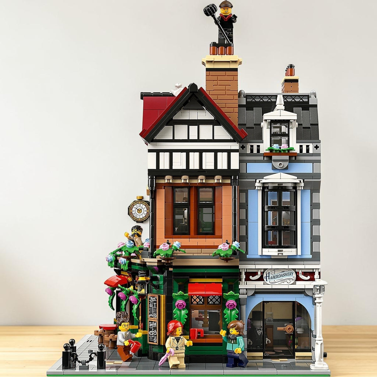 [lifestyle-shelf-built] A Brick Apart LEGO Icons Tudor Corner modular building set featuring detailed timber facades and eight minifigures.