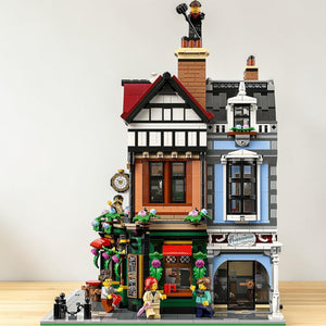 [lifestyle-shelf-built] A Brick Apart LEGO Icons Tudor Corner modular building set featuring detailed timber facades and eight minifigures.