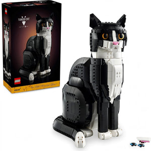 A Brick Apart LEGO Ideas Tuxedo Cat model with black and white bricks, yellow eyes, and adjustable poseable features.