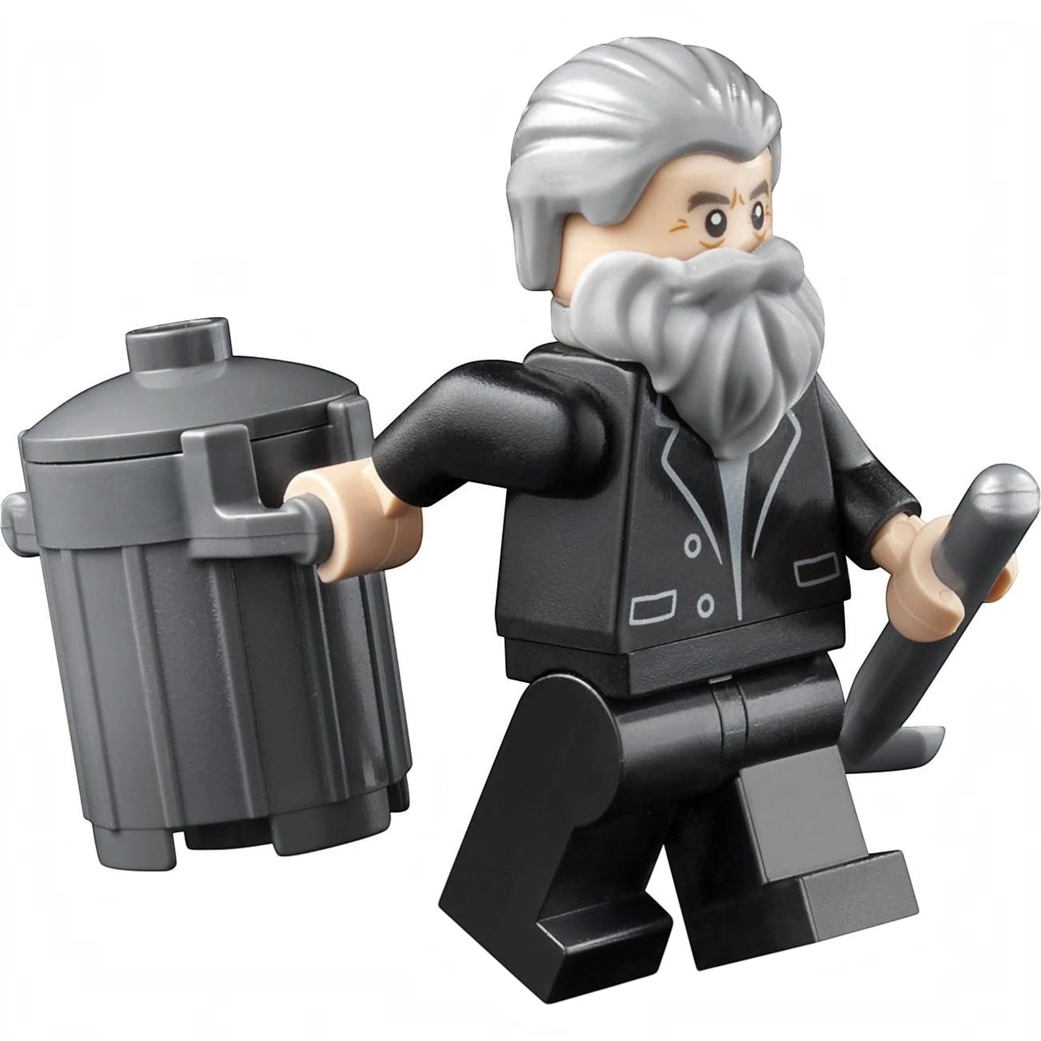A Brick Apart LEGO Old Man Marley minifigure from the Home Alone set holding a grey trash can and a shovel.