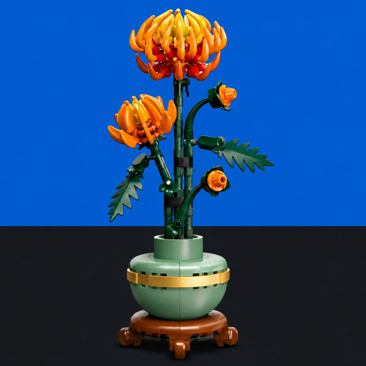 [built-blue-black] A LEGO-style floral vase sculpture with two orange flowers, green stems and leaves, a pale green vase, and a brown pedestal, shown against a blue and black background.