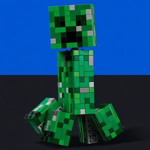 [built-blue-black] A green blocky toy figure resembling a Minecraft creeper, posed sitting down against a split blue and black studio background.