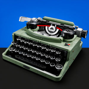 [built-blue-black] Green LEGO typewriter 3/4 display on a blue and black background
